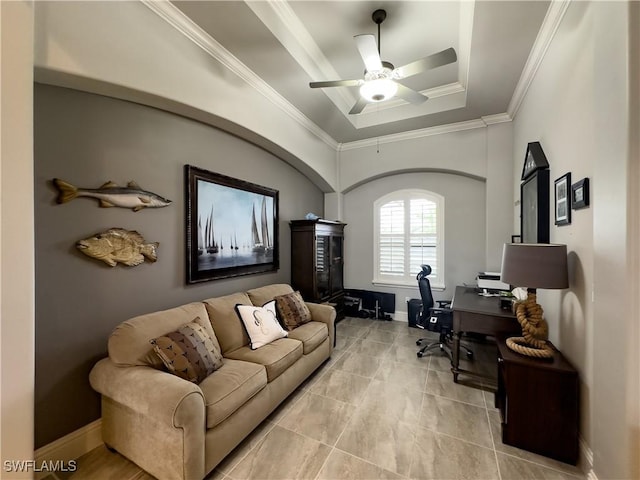 office area featuring a tray ceiling, ornamental molding, and ceiling fan