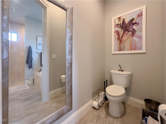 bathroom with toilet and tile patterned flooring