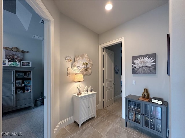 hall featuring tile patterned flooring