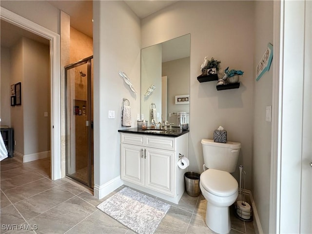 bathroom with toilet, tile patterned flooring, an enclosed shower, and vanity