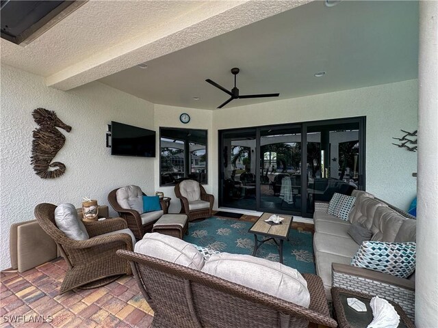 view of patio / terrace featuring ceiling fan and an outdoor living space