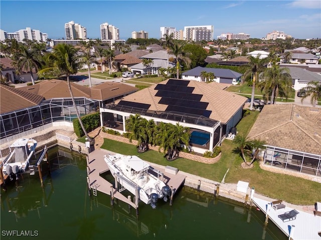 birds eye view of property with a water view