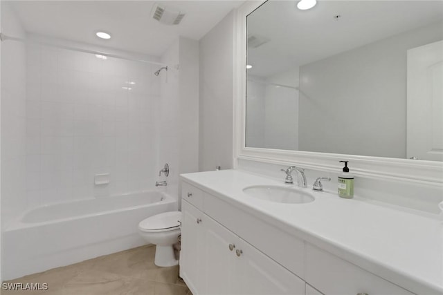 full bathroom with toilet, tiled shower / bath combo, tile patterned floors, and vanity