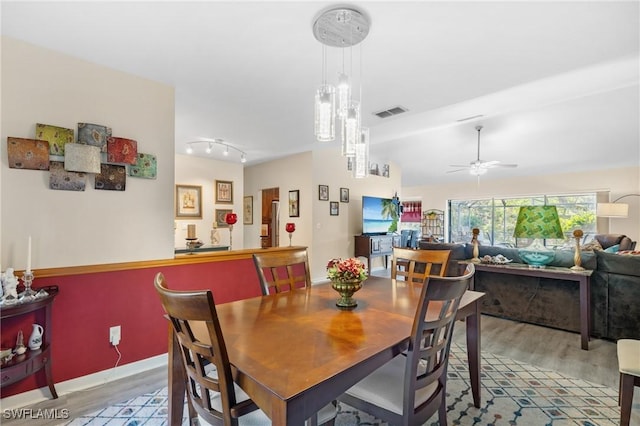 dining room featuring ceiling fan and wood-type flooring