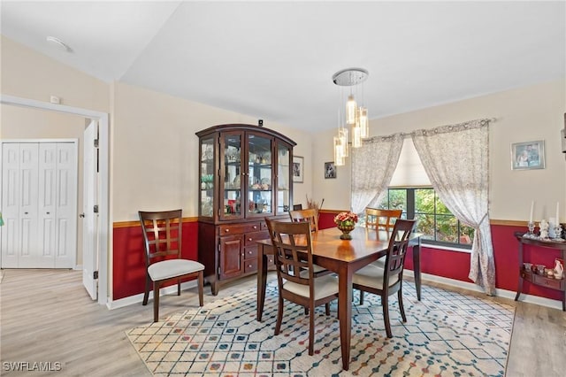 dining area with light hardwood / wood-style floors