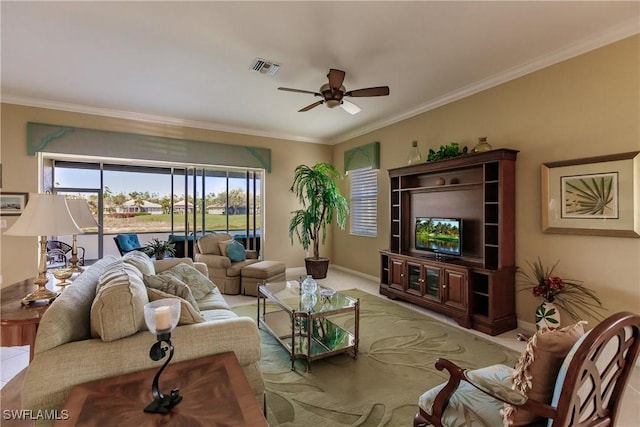 living room featuring ceiling fan, crown molding, and carpet floors