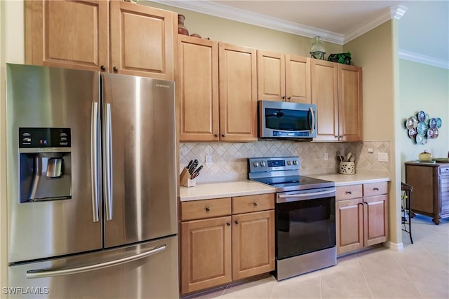 kitchen with appliances with stainless steel finishes, ornamental molding, decorative backsplash, and light tile patterned floors