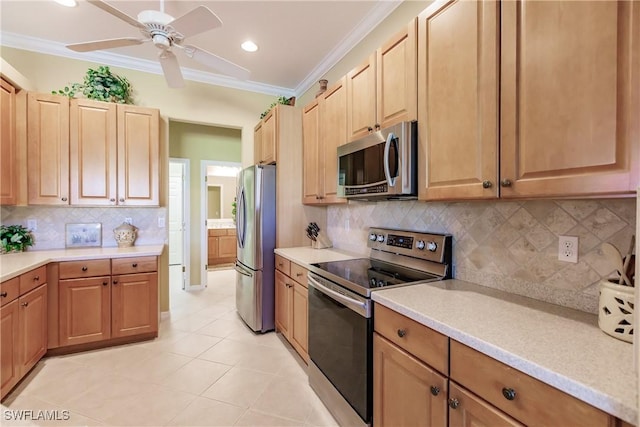 kitchen with stainless steel appliances, light tile patterned floors, ornamental molding, ceiling fan, and backsplash