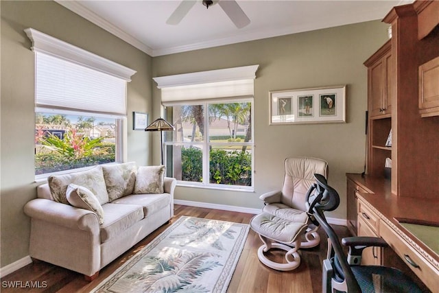 living room featuring ornamental molding, ceiling fan, and dark hardwood / wood-style flooring