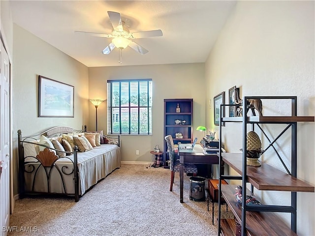 office space featuring baseboards, a ceiling fan, and carpet flooring