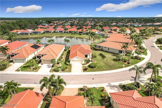 aerial view with a residential view and a water view