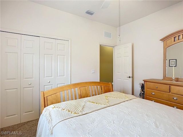 bedroom with a closet, carpet flooring, and visible vents