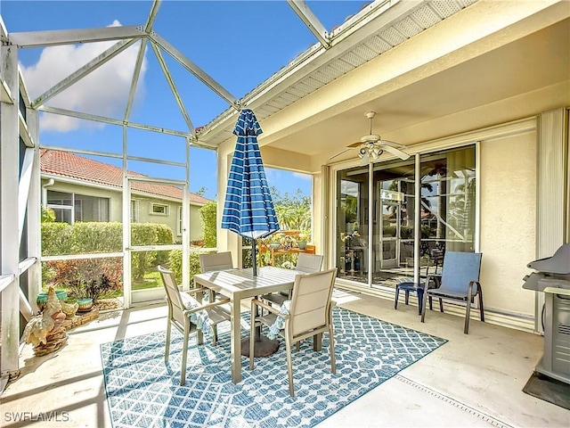 view of patio featuring outdoor dining area and a ceiling fan