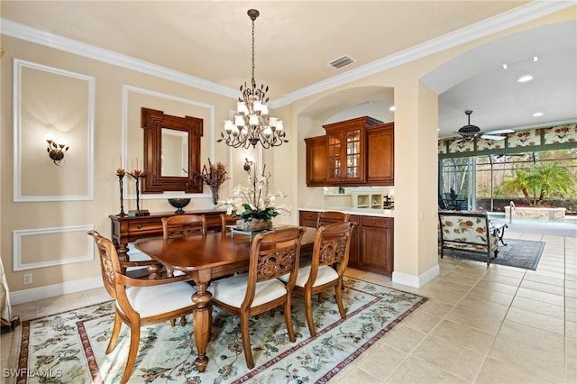 dining room with light tile patterned flooring, crown molding, and ceiling fan with notable chandelier