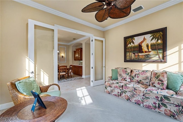 carpeted living room featuring ceiling fan, french doors, and ornamental molding