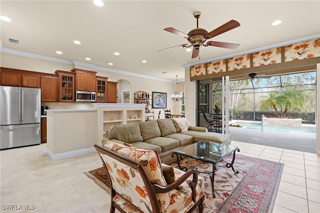 tiled living room featuring ceiling fan and ornamental molding