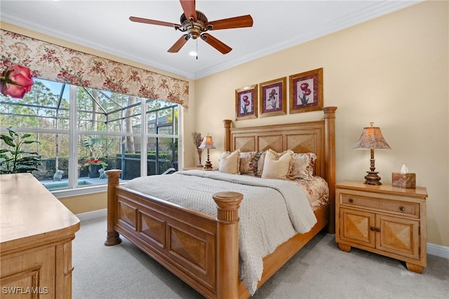 carpeted bedroom featuring ceiling fan, multiple windows, and ornamental molding