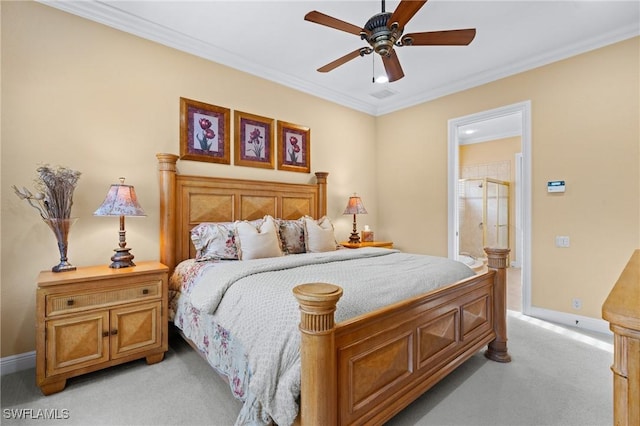 bedroom featuring ceiling fan, light colored carpet, connected bathroom, and ornamental molding