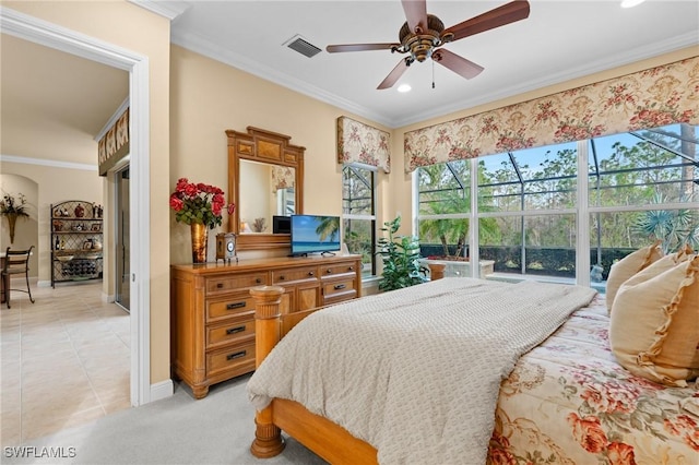 bedroom featuring ceiling fan, light tile patterned flooring, and crown molding