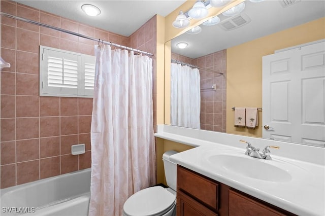 full bathroom with toilet, vanity, and shower / bath combo with shower curtain