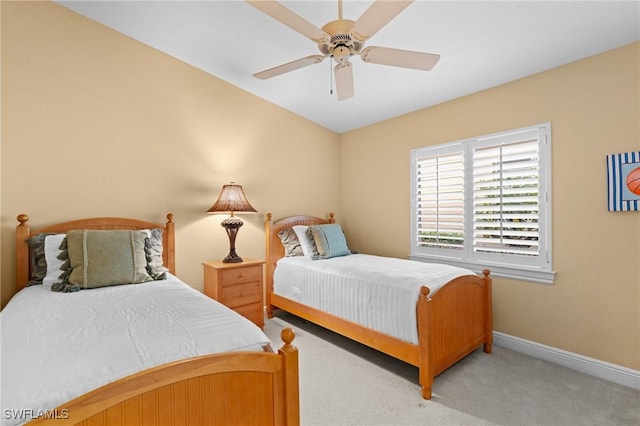 bedroom with ceiling fan and carpet flooring