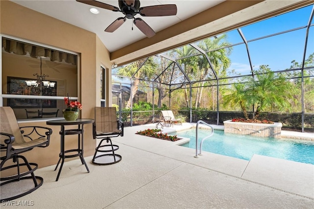 view of swimming pool with ceiling fan, glass enclosure, a jacuzzi, and a patio