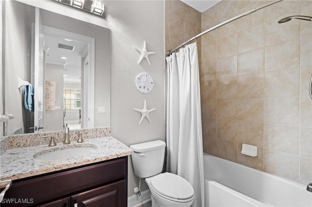 full bathroom with toilet, vanity, and shower / bath combo with shower curtain