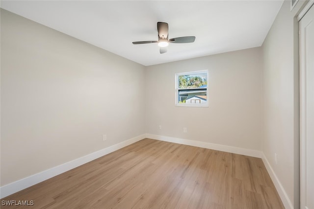 unfurnished room featuring ceiling fan and light wood-type flooring