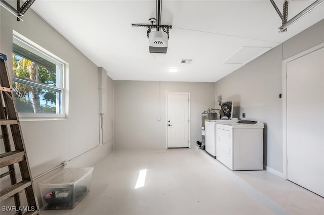 laundry area featuring water heater and independent washer and dryer