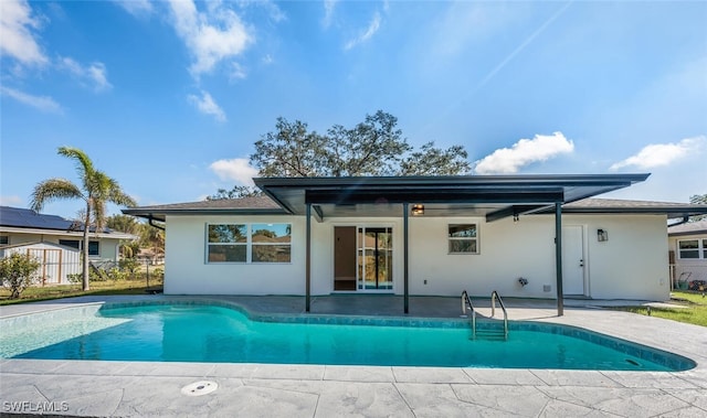 rear view of property featuring a patio