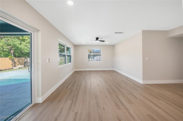 empty room featuring ceiling fan and light hardwood / wood-style flooring