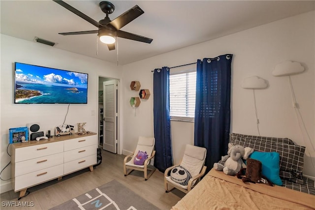 bedroom featuring ceiling fan and light hardwood / wood-style floors