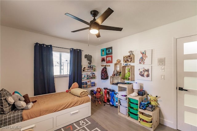 bedroom featuring ceiling fan and wood-type flooring