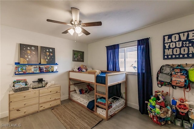 bedroom featuring ceiling fan and light hardwood / wood-style floors