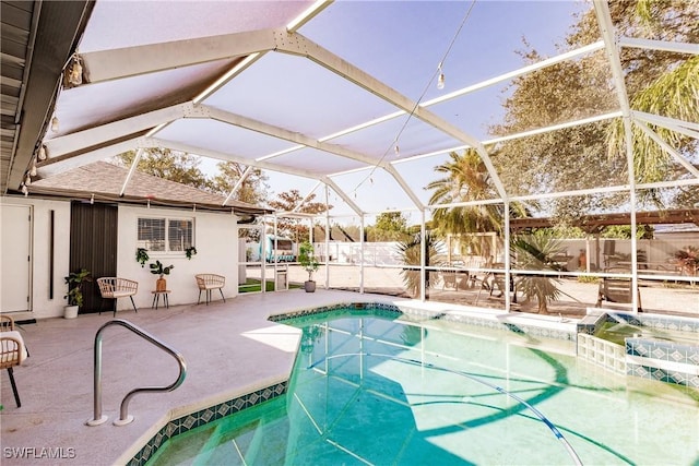 view of pool with a lanai and a patio