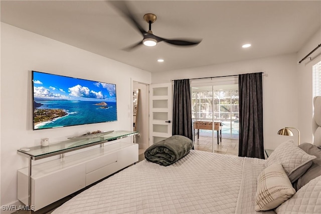 bedroom with ceiling fan, multiple windows, and access to exterior