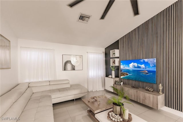 tiled living room with lofted ceiling