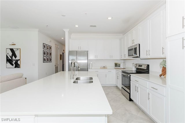 kitchen featuring a kitchen island with sink, ornamental molding, sink, and appliances with stainless steel finishes