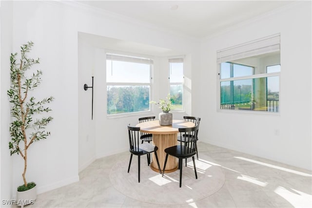 dining room featuring ornamental molding