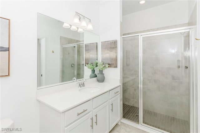 bathroom with vanity and walk in shower