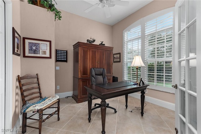 office space featuring ceiling fan and light tile patterned floors