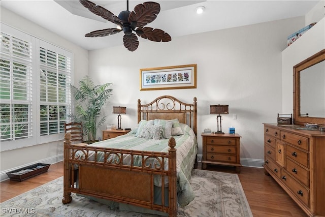 bedroom featuring ceiling fan and hardwood / wood-style floors