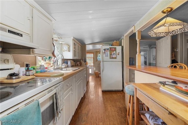 6253 Valeria Rd, Bokeelia, FL 33922 - kitchen featuring white cabinets, white appliances, decorative light fixtures, and sink