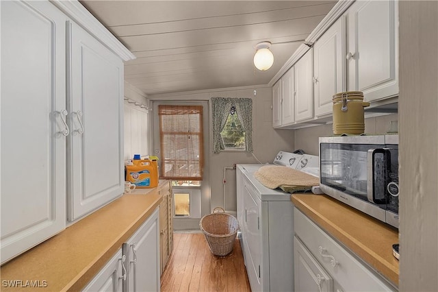 6253 Valeria Rd, Bokeelia, FL 33922 - laundry room featuring separate washer and dryer and light hardwood / wood-style flooring