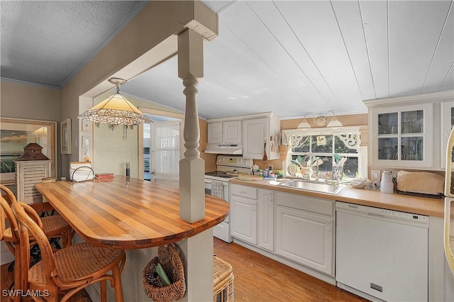 6253 Valeria Rd, Bokeelia, FL 33922 - kitchen featuring white appliances, white cabinets, hanging light fixtures, light hardwood / wood-style flooring, and ornamental molding