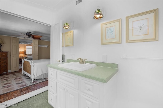 6253 Valeria Rd, Bokeelia, FL 33922 - bathroom with tile patterned floors, ceiling fan, and vanity
