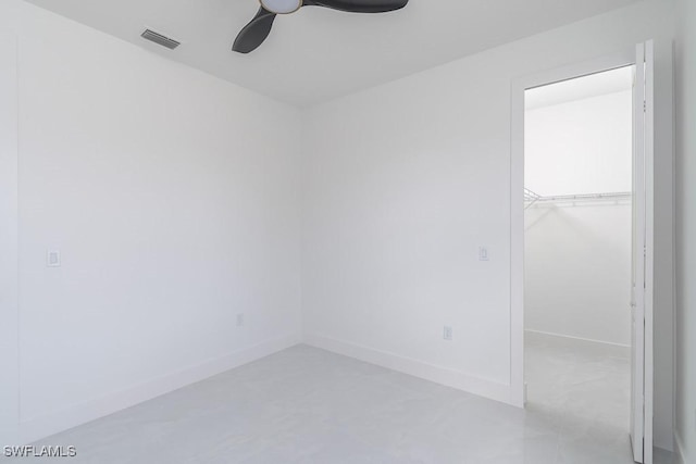 spare room with ceiling fan