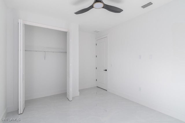 unfurnished bedroom featuring a closet and ceiling fan