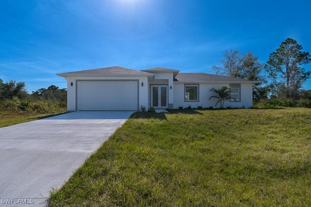 view of front of property with a front lawn and a garage