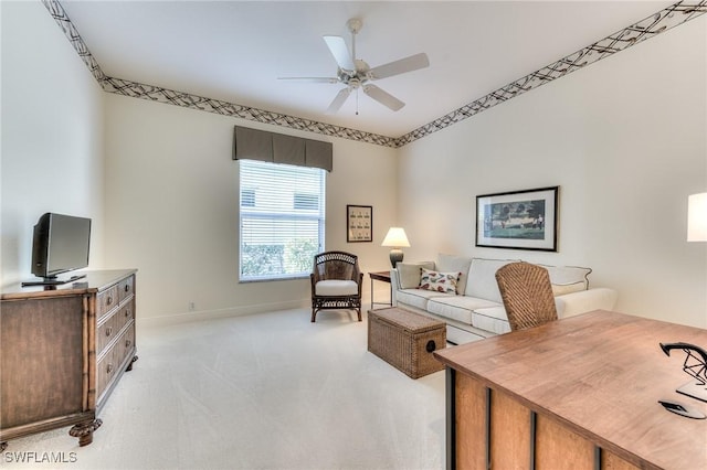 home office featuring ceiling fan and light colored carpet